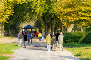 groups of people walking in a local park