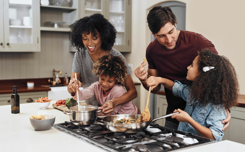 family cooking together in their home