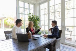 realtor speaking with potential customers in garden